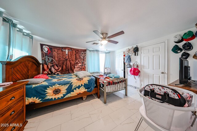 5239 W Maryland Ave, Glendale, AZ 85301 - bedroom with light marble finish flooring and ceiling fan