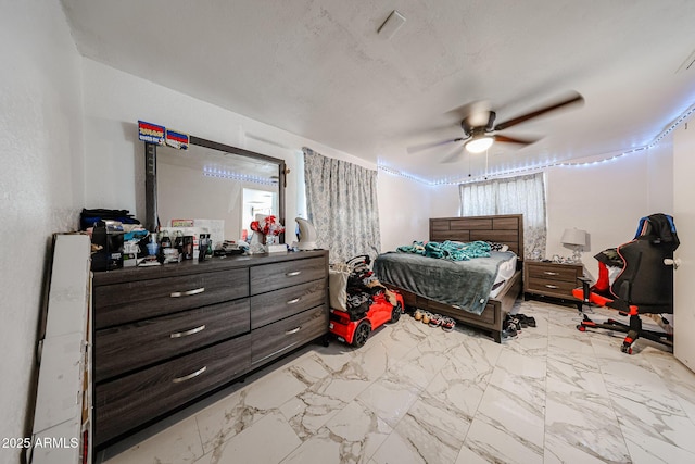 5239 W Maryland Ave, Glendale, AZ 85301 - bedroom featuring marble look tile flooring and a ceiling fan