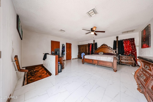 5239 W Maryland Ave, Glendale, AZ 85301 - bedroom featuring light marble finish flooring, a textured ceiling, a ceiling fan, and baseboards