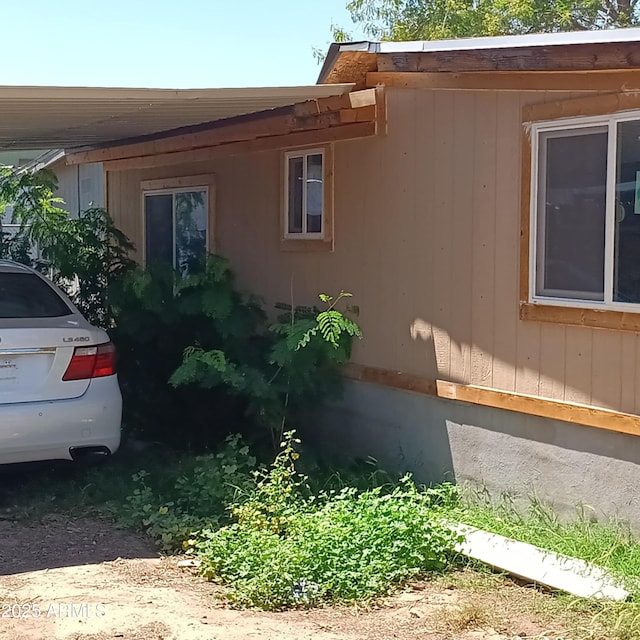 5239 W Maryland Ave, Glendale, AZ 85301 - view of side of home featuring an attached carport