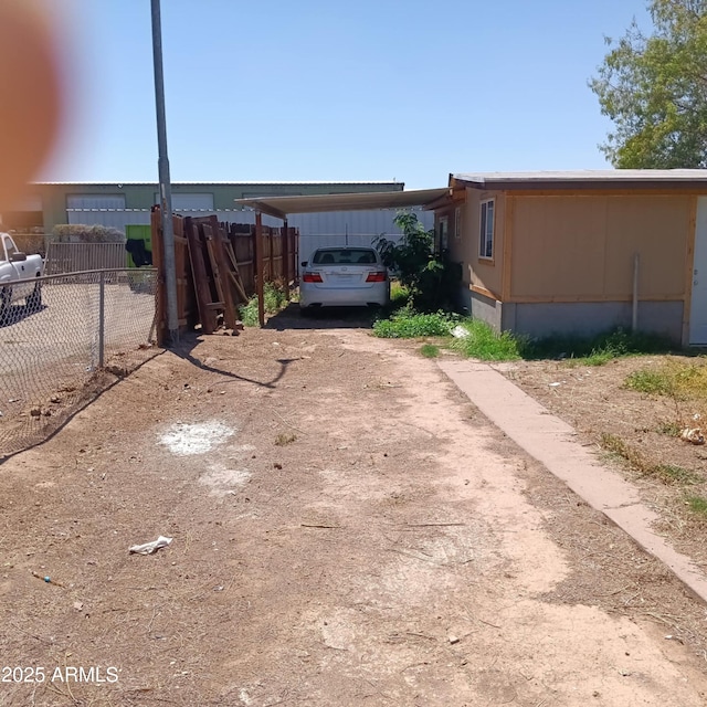 5239 W Maryland Ave, Glendale, AZ 85301 - view of yard featuring a carport, fence, and driveway