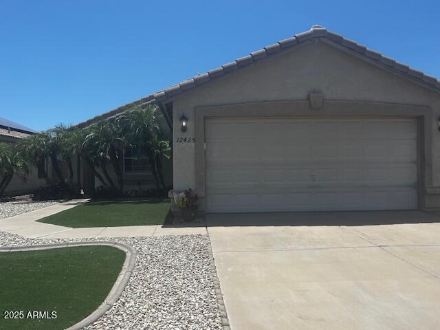 12425 W Willow Ave, El Mirage, AZ 85335 - garage with concrete driveway
