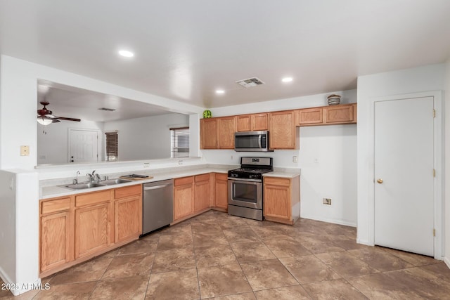 12425 W Willow Ave, El Mirage, AZ 85335 - kitchen featuring stainless steel appliances, a sink, a ceiling fan, light countertops, and recessed lighting