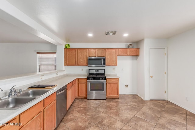 12425 W Willow Ave, El Mirage, AZ 85335 - kitchen featuring stainless steel appliances, a sink, light countertops, and recessed lighting
