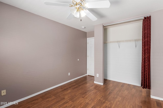 12425 W Willow Ave, El Mirage, AZ 85335 - unfurnished bedroom featuring baseboards, wood finished floors, a closet, and a ceiling fan