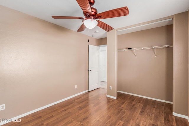 12425 W Willow Ave, El Mirage, AZ 85335 - unfurnished bedroom with a closet, wood finished floors, baseboards, and a ceiling fan
