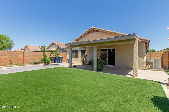 12425 W Willow Ave, El Mirage, AZ 85335 - back of house with central AC unit, a patio, stucco siding, and a tile roof