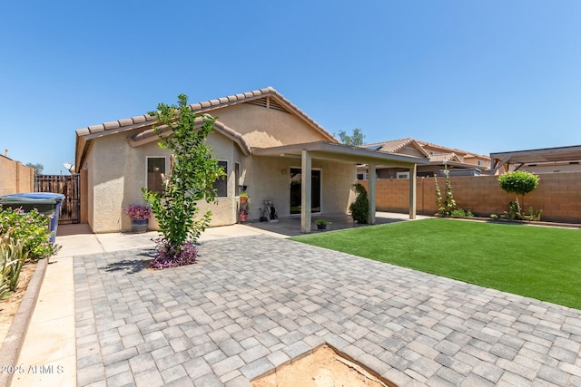 12425 W Willow Ave, El Mirage, AZ 85335 - rear view of property featuring a patio, stucco siding, and a tiled roof