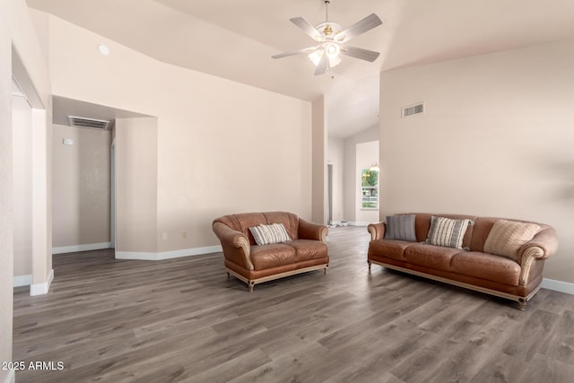 living area with baseboards, ceiling fan, wood finished floors, and visible vents