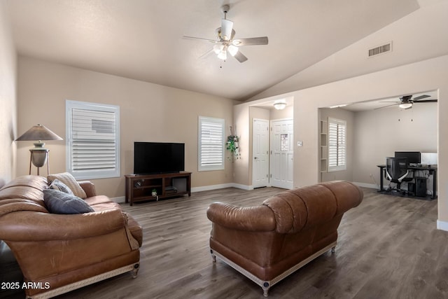 living area with a ceiling fan, visible vents, wood finished floors, and vaulted ceiling