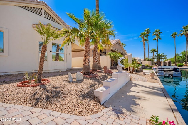 exterior space with fence and stucco siding