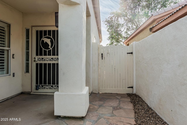 14624 N 90th Ln, Peoria, AZ 85381 - property entrance with stucco siding and a gate