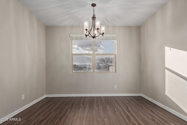 18360 W Alice Ave, Waddell, AZ 85355 - empty room featuring baseboards, a notable chandelier, and dark wood-type flooring