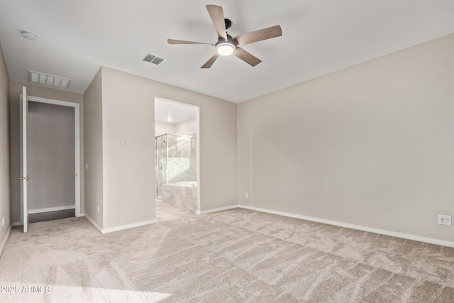 18360 W Alice Ave, Waddell, AZ 85355 - unfurnished bedroom featuring baseboards, carpet floors, ensuite bathroom, and visible vents