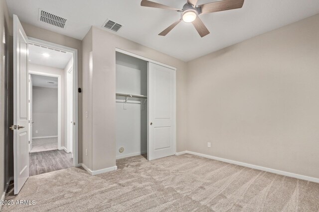 18360 W Alice Ave, Waddell, AZ 85355 - unfurnished bedroom with carpet floors, baseboards, a closet, and visible vents