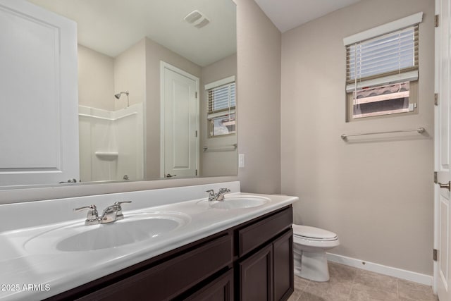 18360 W Alice Ave, Waddell, AZ 85355 - full bath with a sink, baseboards, walk in shower, and visible vents