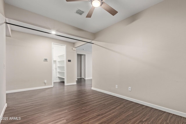 18360 W Alice Ave, Waddell, AZ 85355 - unfurnished room featuring baseboards, dark wood-style floors, visible vents, and a ceiling fan