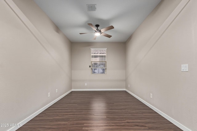 18360 W Alice Ave, Waddell, AZ 85355 - empty room featuring dark wood-type flooring, baseboards, ceiling fan, and visible vents