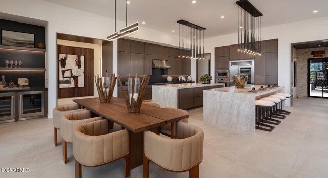 dining room with light tile patterned floors and recessed lighting