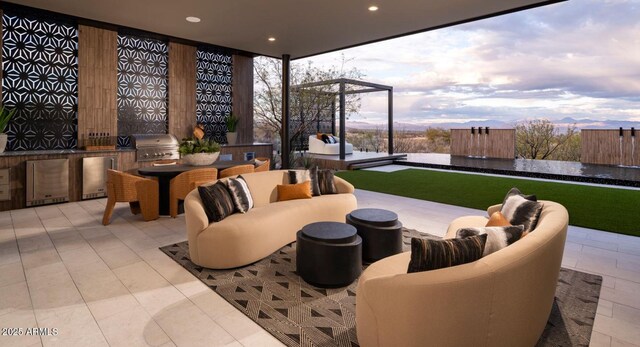 view of patio / terrace with area for grilling, outdoor lounge area, a grill, and outdoor dining space