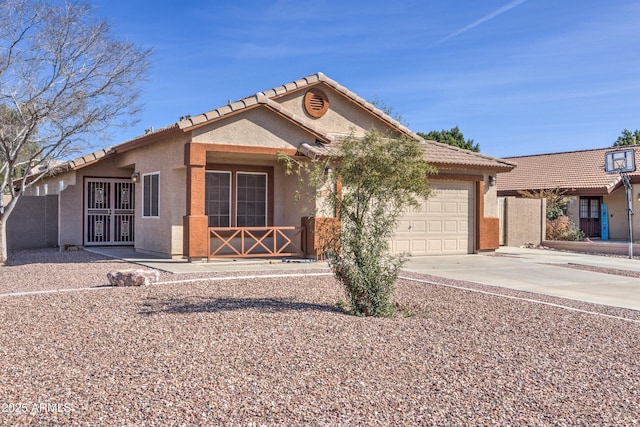 ranch-style house with a garage, stucco siding, concrete driveway, and a tiled roof