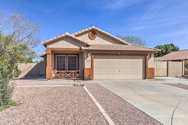 ranch-style home featuring stucco siding, a garage, concrete driveway, fence, and a tiled roof