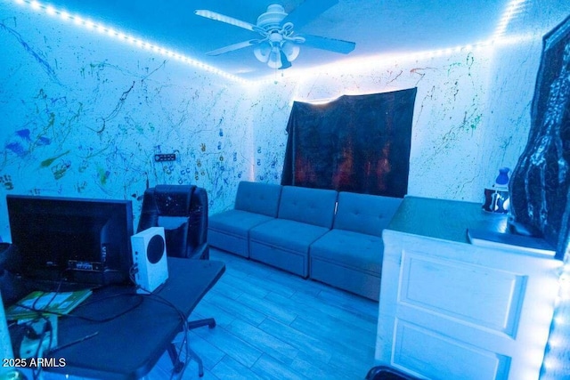 living room featuring a ceiling fan