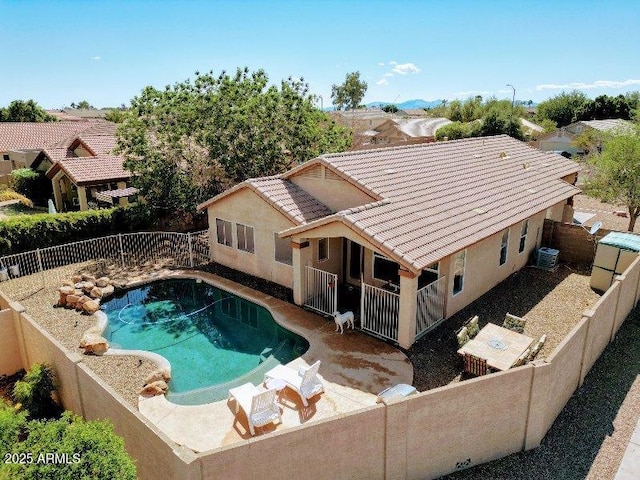 view of swimming pool featuring a fenced backyard, central AC unit, and a patio area