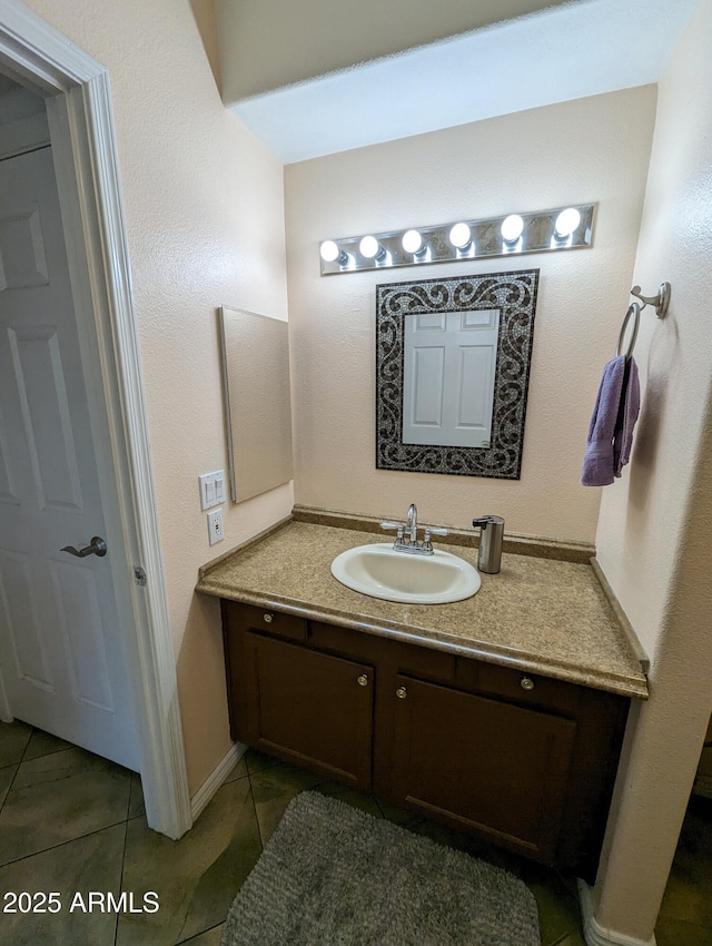 bathroom featuring vanity and tile patterned flooring