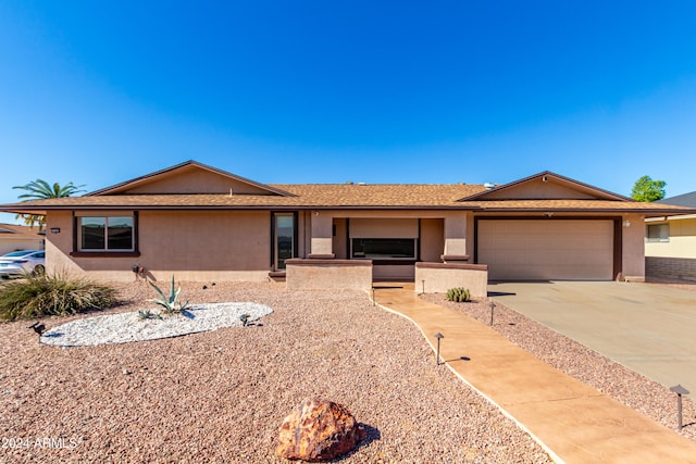 ranch-style home with a garage