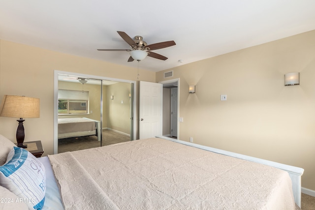 bedroom with a closet, ceiling fan, and carpet floors