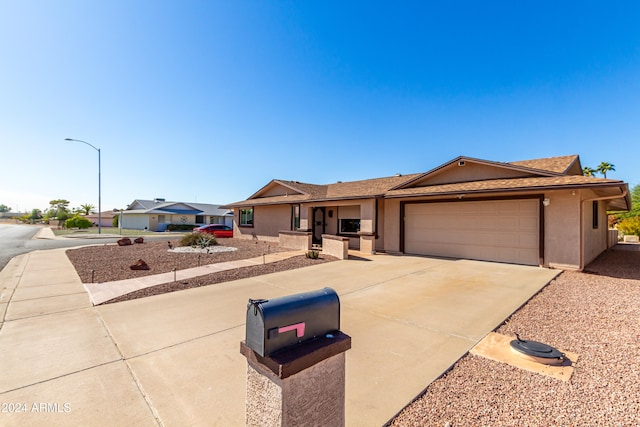 ranch-style home with a garage