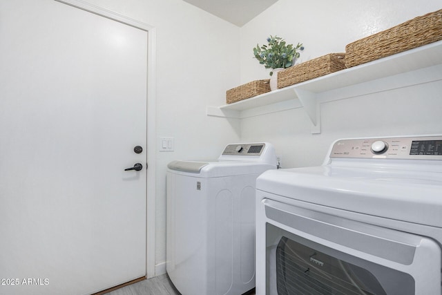 washroom with laundry area and washer and clothes dryer