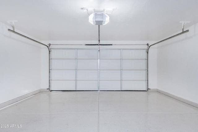 garage featuring baseboards and a garage door opener