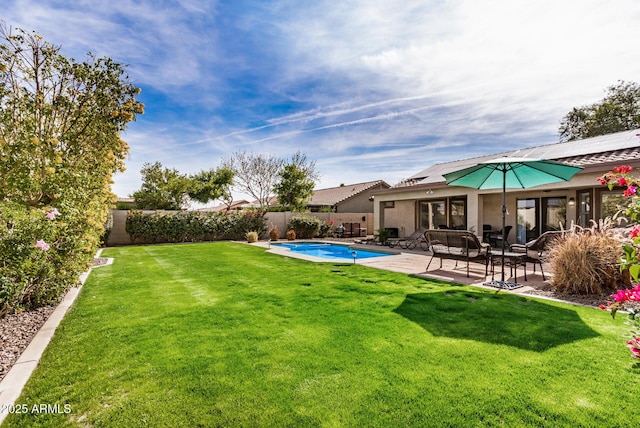 view of yard with a patio area, a fenced backyard, and a fenced in pool