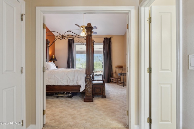 bedroom featuring light colored carpet