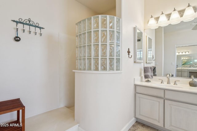 full bathroom with vanity and a walk in shower