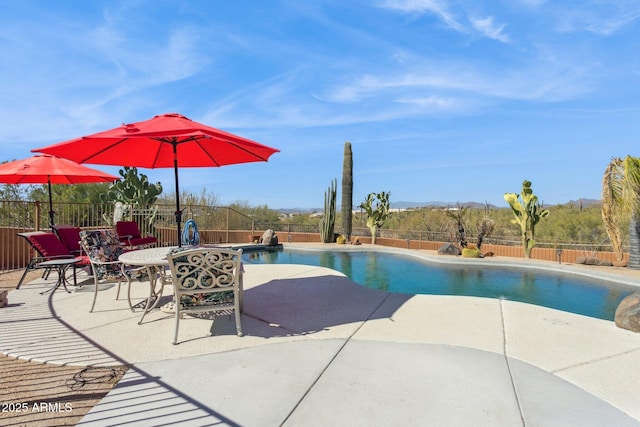 view of pool featuring a fenced in pool, a patio area, and a fenced backyard