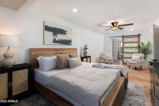 8708 E Rancho Vista Dr, Scottsdale, AZ 85251 - bedroom featuring a barn door, ornamental molding, light wood-style floors, recessed lighting, and ceiling fan