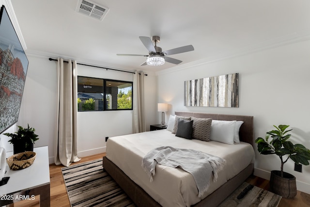8708 E Rancho Vista Dr, Scottsdale, AZ 85251 - bedroom featuring crown molding, wood finished floors, and ceiling fan