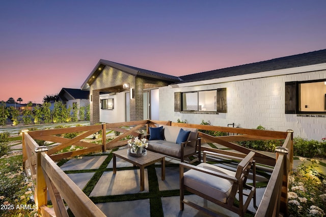 8708 E Rancho Vista Dr, Scottsdale, AZ 85251 - patio terrace at dusk with an outdoor living space