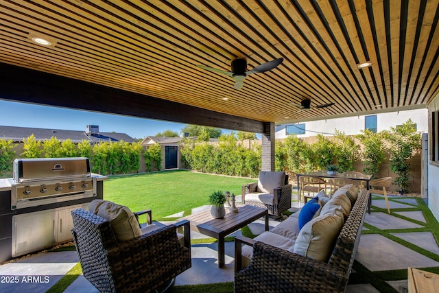 8708 E Rancho Vista Dr, Scottsdale, AZ 85251 - fenced backyard featuring grilling area, an outdoor living space, a patio area, and a ceiling fan