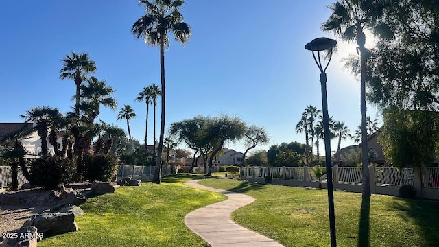 view of property's community with a lawn