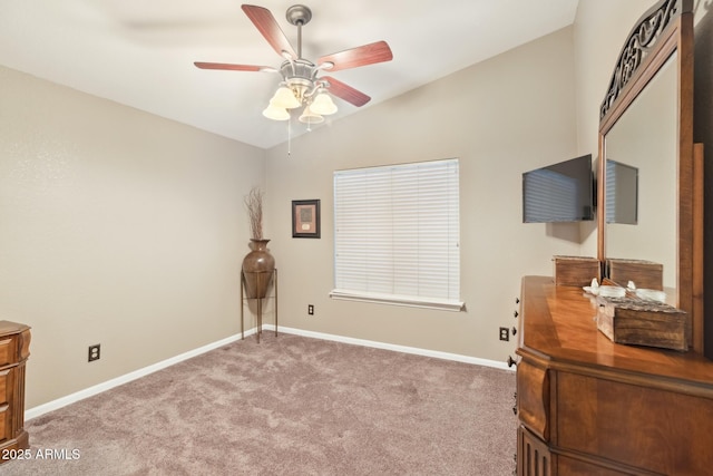 carpeted bedroom featuring ceiling fan and vaulted ceiling