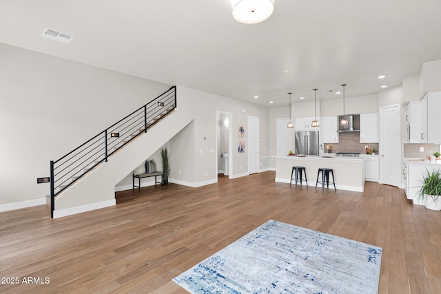 living room with light hardwood / wood-style flooring