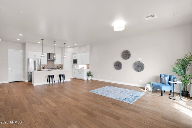 unfurnished living room featuring light wood-type flooring