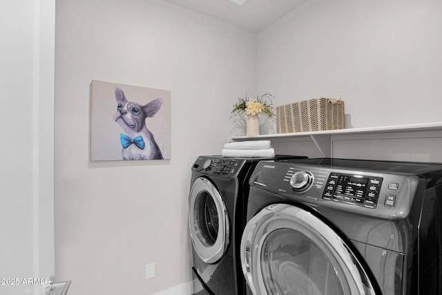 washroom featuring washer and dryer