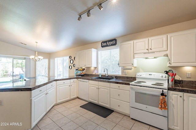 kitchen with white appliances, white cabinets, sink, light tile patterned floors, and a notable chandelier