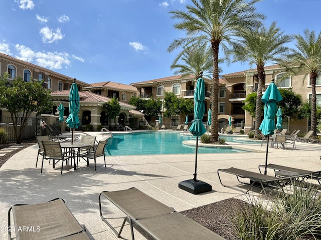 view of swimming pool featuring a patio