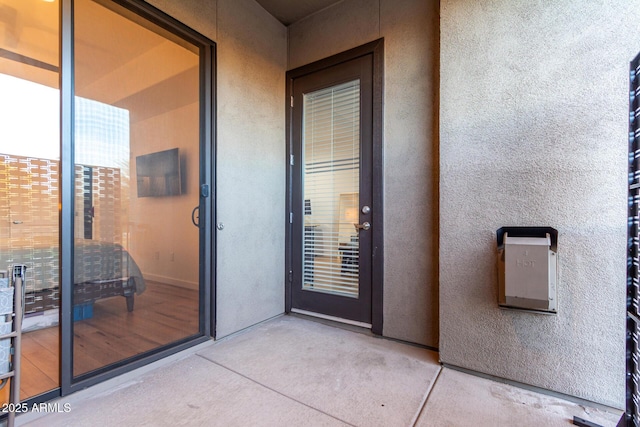 entrance to property with a patio area